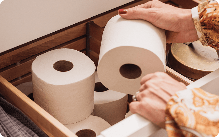 Storing toilet rolls in wooden drawer