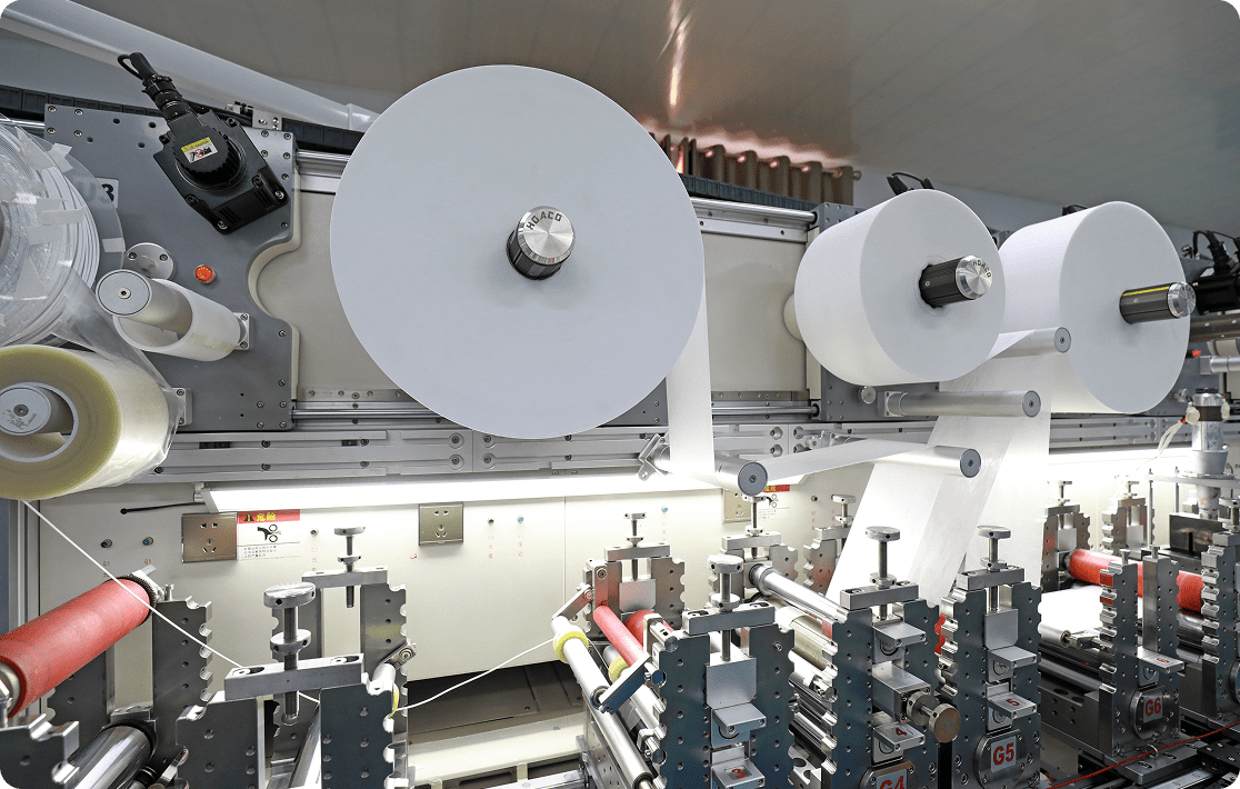 Manufacturing equipment with paper rolls